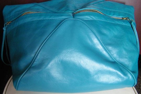 Turquoise handbag restored — before
